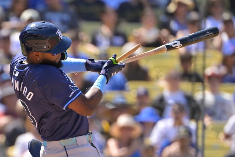 Aug 25, 2024; Los Angeles, California, USA;  Tampa Bay Rays third baseman Junior Caminero (13) breaks his bat on a ground out in the eighth inning against the Los Angeles Dodgers at Dodger Stadium. Mandatory Credit: Jayne Kamin-Oncea-USA TODAY Sports