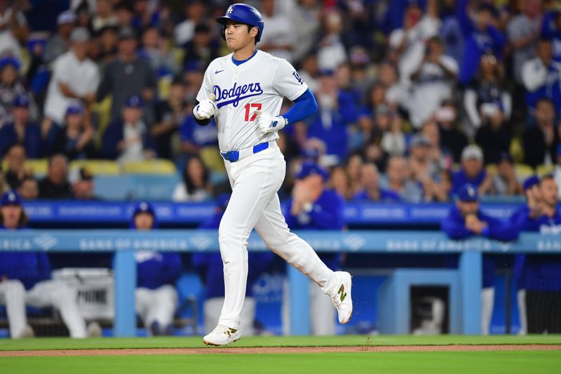 Sep 24, 2024; Los Angeles, California, USA; Los Angeles Dodgers designated hitter Shohei Ohtani (17) scores a run on a throwing error by San Diego Padres shortstop Xander Bogaerts (2) during the first inning at Dodger Stadium. Mandatory Credit: Gary A. Vasquez-Imagn Images