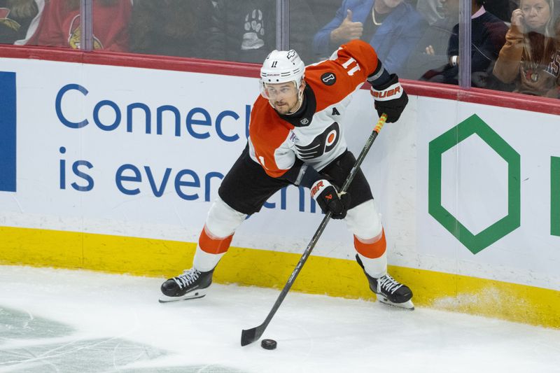 Oct 23, 2025; Ottawa, Ontario, CAN; Philadelphia Flyers right wing Travis Konecny (11) controls the puck in the third period against the Ottawa Senators at the Canadian Tire Centre. Mandatory Credit: Marc DesRosiers-IMAGN Images