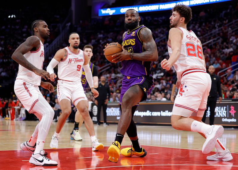 HOUSTON, TEXAS - NOVEMBER 08: LeBron James #23 of the Los Angeles Lakers drives to the net ahead of Alperen Sengun #28 of the Houston Rockets during the first half at Toyota Center on November 08, 2023 in Houston, Texas. NOTE TO USER: User expressly acknowledges and agrees that, by downloading and or using this photograph, User is consenting to the terms and conditions of the Getty Images License Agreement.? (Photo by Carmen Mandato/Getty Images)