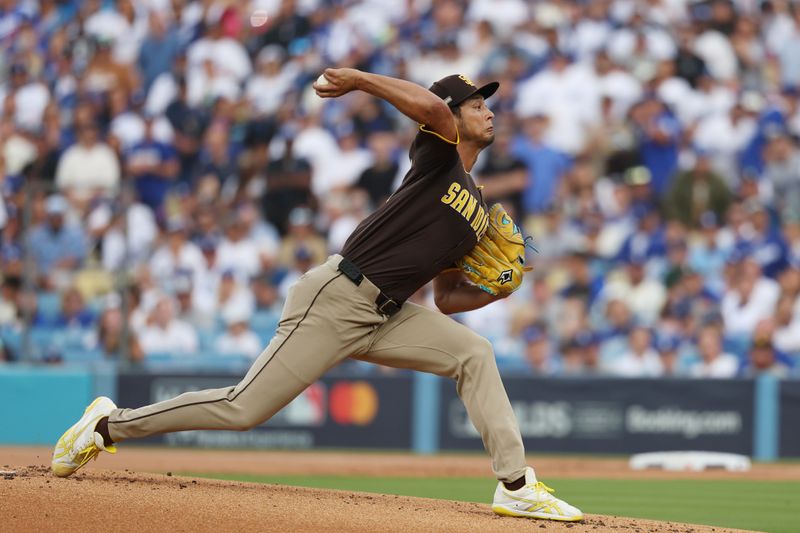 Oct 11, 2024; Los Angeles, California, USA; San Diego Padres pitcher Yu Darvish (11) pitches against the Los Angeles Dodgers in the first inning during game five of the NLDS for the 2024 MLB Playoffs at Dodger Stadium. Mandatory Credit: Kiyoshi Mio-Imagn Images