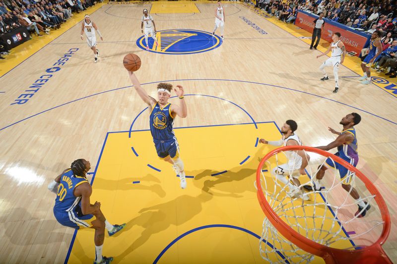 SAN FRANCISCO, CA - JANUARY 4: Brandin Podziemski #2 of the Golden State Warriors rebounds the ball during the game against the Denver Nuggets on January 4, 2024 at Chase Center in San Francisco, California. NOTE TO USER: User expressly acknowledges and agrees that, by downloading and or using this photograph, user is consenting to the terms and conditions of Getty Images License Agreement. Mandatory Copyright Notice: Copyright 2024 NBAE (Photo by Noah Graham/NBAE via Getty Images)