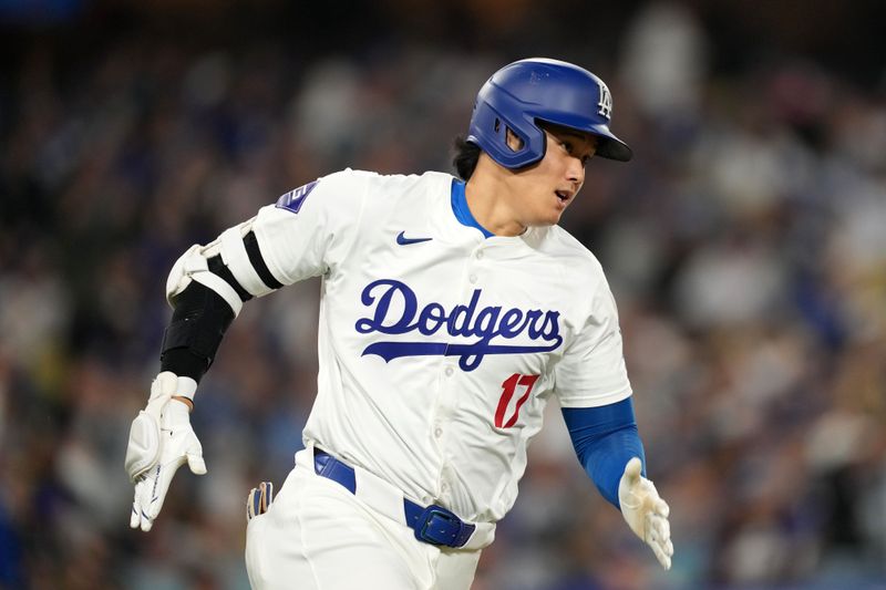 May 21, 2024; Los Angeles, California, USA; Los Angeles Dodgers designated hitter Shohei Ohtani (17) runs the bases on a double in the fourth inning against the Arizona Diamondbacks at Dodger Stadium. Mandatory Credit: Kirby Lee-USA TODAY Sports