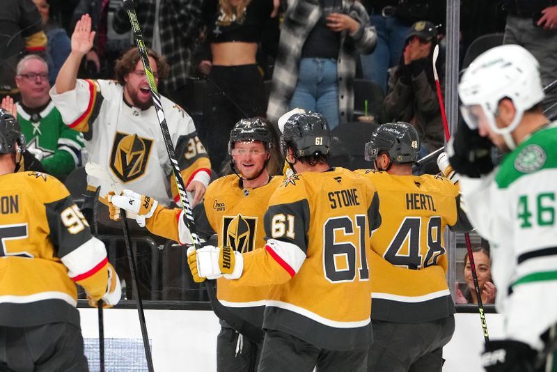 Dec 6, 2024; Las Vegas, Nevada, USA; Vegas Golden Knights center Jack Eichel (9) celebrates with teammates after scoring a goal against the Dallas Stars during the second period at T-Mobile Arena. Mandatory Credit: Stephen R. Sylvanie-Imagn Images