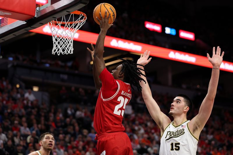 Mar 16, 2024; Minneapolis, MN, USA; Wisconsin Badgers guard John Blackwell (25) shoots as Purdue Boilermakers center Zach Edey (15) defends during the second half at Target Center. Mandatory Credit: Matt Krohn-USA TODAY Sports