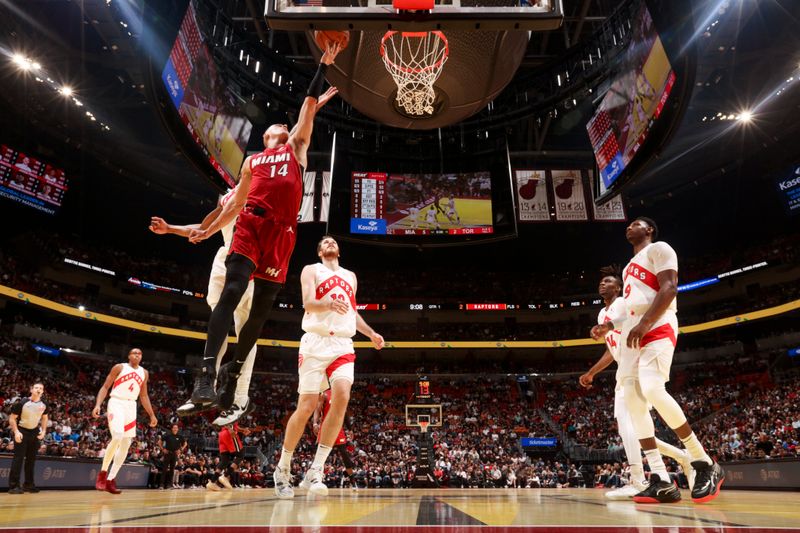 MIAMI, FL - NOVEMBER 29: Tyler Herro #14 of the Miami Heat shoots the ball during the game against the Toronto Raptors in the NBA Cup on November 29, 2024 at Kaseya Center in Miami, Florida. NOTE TO USER: User expressly acknowledges and agrees that, by downloading and or using this Photograph, user is consenting to the terms and conditions of the Getty Images License Agreement. Mandatory Copyright Notice: Copyright 2024 NBAE (Photo by Issac Baldizon/NBAE via Getty Images)