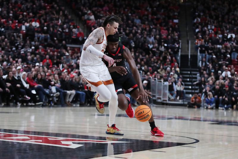 Feb 13, 2023; Lubbock, Texas, USA;  Texas Tech Red Raiders forward Robert Jennings (4) works the ball against Texas Longhorns forward Christian Bishop (32) in the second half at United Supermarkets Arena. Mandatory Credit: Michael C. Johnson-USA TODAY Sports