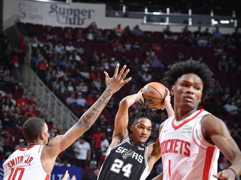 HOUSTON, TX - MARCH 5: Devin Vassell #24 of the San Antonio Spurs looks to pass the ball during the game against the Houston Rockets  on March 5, 2024 at the Toyota Center in Houston, Texas. NOTE TO USER: User expressly acknowledges and agrees that, by downloading and or using this photograph, User is consenting to the terms and conditions of the Getty Images License Agreement. Mandatory Copyright Notice: Copyright 2024 NBAE (Photo by Logan Riely/NBAE via Getty Images)