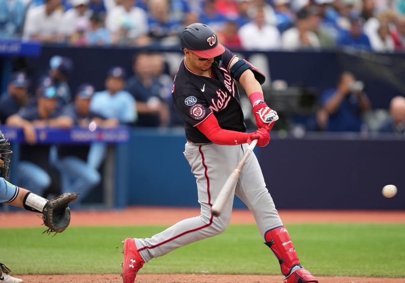 Aug 30, 2023; Toronto, Ontario, CAN; Washington Nationals first baseman Joey Meneses (45) hits a single against the Toronto Blue Jays during the ninth inning at Rogers Centre. Mandatory Credit: Nick Turchiaro-USA TODAY Sports