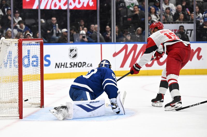 Mar 20, 2026; Toronto, Ontario, CAN;  Carolina Hurricanes defenseman K'Andre Miller (19) scores a goal past Toronto Maple Leafs goalie Joseph Woll (60) in the second period at Scotiabank Arena. Mandatory Credit: Dan Hamilton-Imagn Images