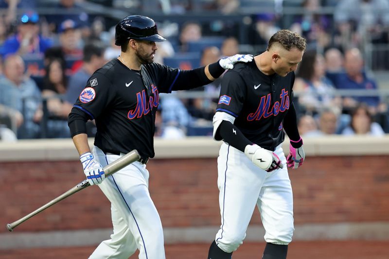 May 24, 2024; New York City, New York, USA; New York Mets designated hitter J.D. Martinez (28) checks on left fielder Brandon Nimmo (9) after Nimmo was hit in the helmet by a pitch during the third inning against the San Francisco Giants at Citi Field. Mandatory Credit: Brad Penner-USA TODAY Sports