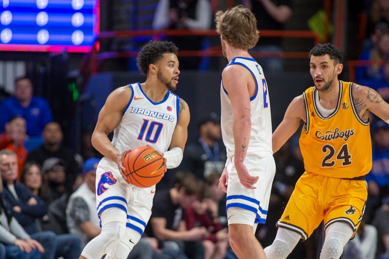 Feb 11, 2023; Boise, Idaho, USA;  State Broncos guard Marcus Shaver Jr. (10) dribbles during the first half against the Wyoming Cowboys at ExtraMile Arena. Mandatory Credit: Brian Losness-USA TODAY Sports

