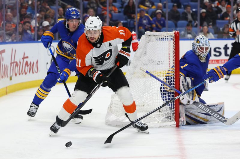 Apr 5, 2024; Buffalo, New York, USA;  Buffalo Sabres defenseman Owen Power (25) defends as Philadelphia Flyers right wing Travis Konecny (11) looks to make a pass during the third period at KeyBank Center. Mandatory Credit: Timothy T. Ludwig-USA TODAY Sports