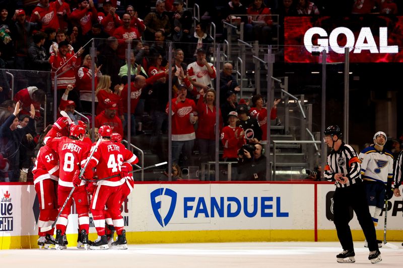 Feb 24, 2024; Detroit, Michigan, USA;  Detroit Red Wings center Robby Fabbri (14) receives congratulations from teammates after scoring in the first period against the St. Louis Blues at Little Caesars Arena. Mandatory Credit: Rick Osentoski-USA TODAY Sports