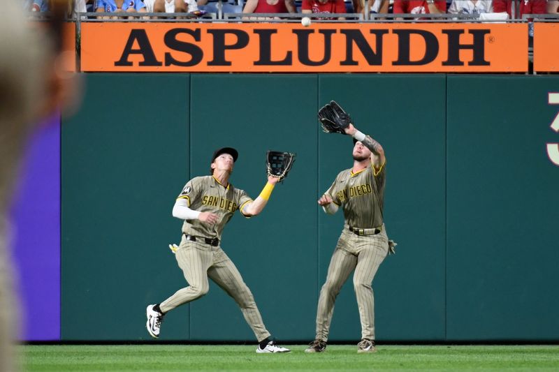 Jun 30, 2025; Philadelphia, Pennsylvania, USA; San Diego Padres outfielder Jackson Merrill (3) catches a fly ball and avoids outfielder Bryce Johnson (29) during the eighth inning against the Philadelphia Phillies at Citizens Bank Park. Mandatory Credit: Eric Hartline-Imagn Images