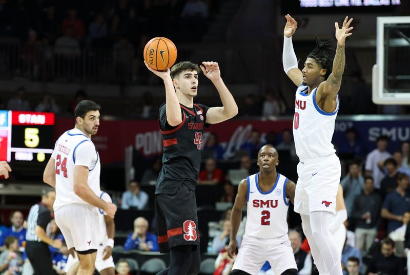 Feb 1, 2025; Dallas, Texas, USA;  Stanford Cardinal forward Maxime Raynaud (42) looks to pass as Southern Methodist Mustangs guard B.J. Edwards (0) defends during the first half at Moody Coliseum. Mandatory Credit: Kevin Jairaj-Imagn Images