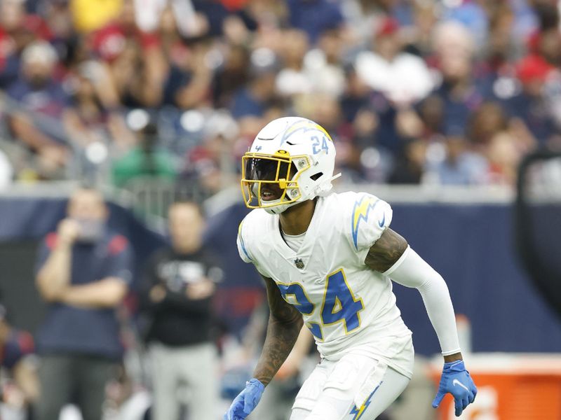 Los Angeles Chargers defensive back Nasir Adderley (24) drops in coverage during an NFL football game against the Houston Texans on Sunday, October 2, 2022, in Houston. (AP Photo/Matt Patterson)