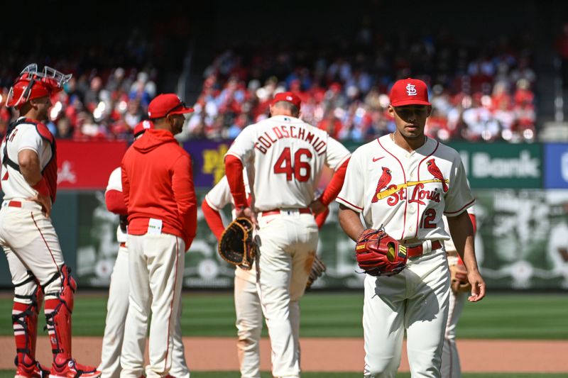 Apr 1, 2023; St. Louis, Missouri, USA; St. Louis Cardinals relief pitcher Jordan Hicks (12) walks to the dugout after being pulled from the game against the Toronto Blue Jays in the eighth inning at Busch Stadium. Mandatory Credit: Joe Puetz-USA TODAY Sports