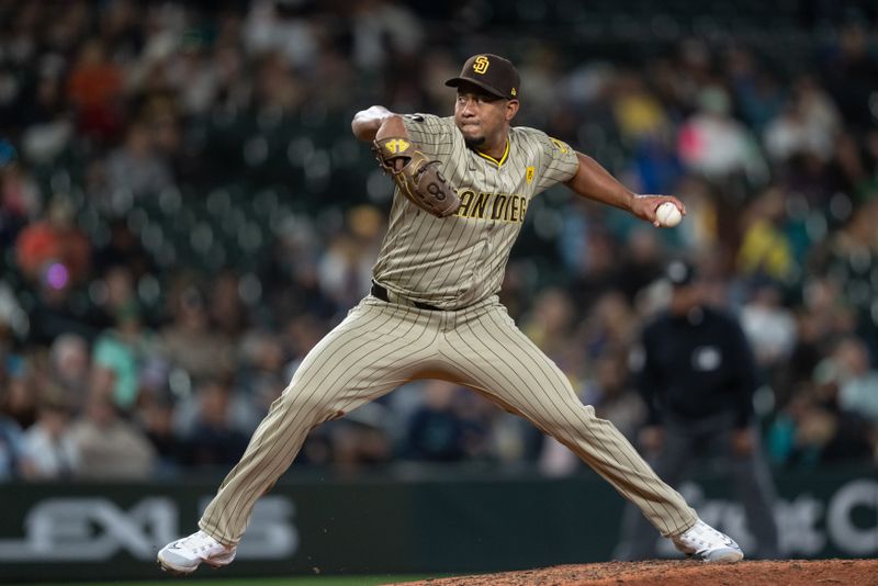 Sep 11, 2024; Seattle, Washington, USA;  San Diego Padres reliever Wandy Peralta (58) delivers a pitch during the eighth inning against the Seattle Mariners at T-Mobile Park. Mandatory Credit: Stephen Brashear-Imagn Images