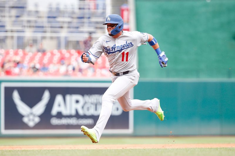 Sep 10, 2023; Washington, District of Columbia, USA; Los Angeles Dodgers shortstop Miguel Rojas (11) runs to third base ahead of a tag against the Washington Nationals during the second inning at Nationals Park. Mandatory Credit: Amber Searls-USA TODAY Sports