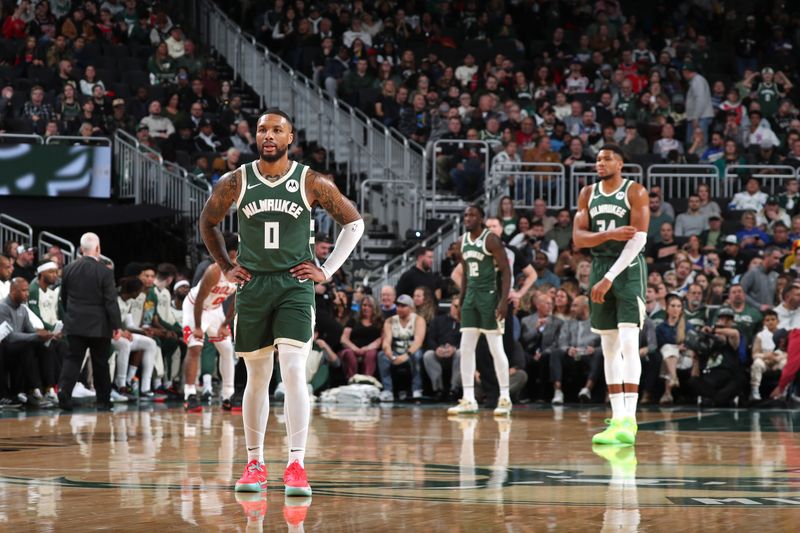 MILWAUKEE, WI - NOVEMBER 20: Damian Lillard #0 and Giannis Antetokounmpo #34 of the Milwaukee Bucks look on during the game against the Chicago Bulls on November 20, 2024 at the Fiserv Forum Center in Milwaukee, Wisconsin. NOTE TO USER: User expressly acknowledges and agrees that, by downloading and or using this Photograph, user is consenting to the terms and conditions of the Getty Images License Agreement. Mandatory Copyright Notice: Copyright 2024 NBAE (Photo by Gary Dineen/NBAE via Getty Images).