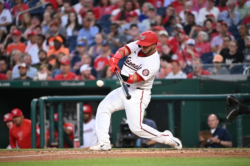 May 8, 2024; Washington, District of Columbia, USA; Washington Nationals catcher Keibert Ruiz (20) gets a base hit against the Baltimore Orioles during the fourth inning at Nationals Park. Mandatory Credit: Rafael Suanes-USA TODAY Sports