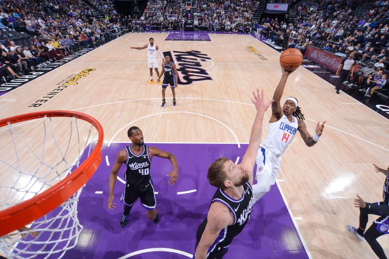 SACRAMENTO, CA - APRIL 2:  Terance Mann #14 of the LA Clippers goes to the basket during the game on April 2, 2024 at Golden 1 Center in Sacramento, California. NOTE TO USER: User expressly acknowledges and agrees that, by downloading and or using this Photograph, user is consenting to the terms and conditions of the Getty Images License Agreement. Mandatory Copyright Notice: Copyright 2024 NBAE (Photo by Rocky Widner/NBAE via Getty Images)