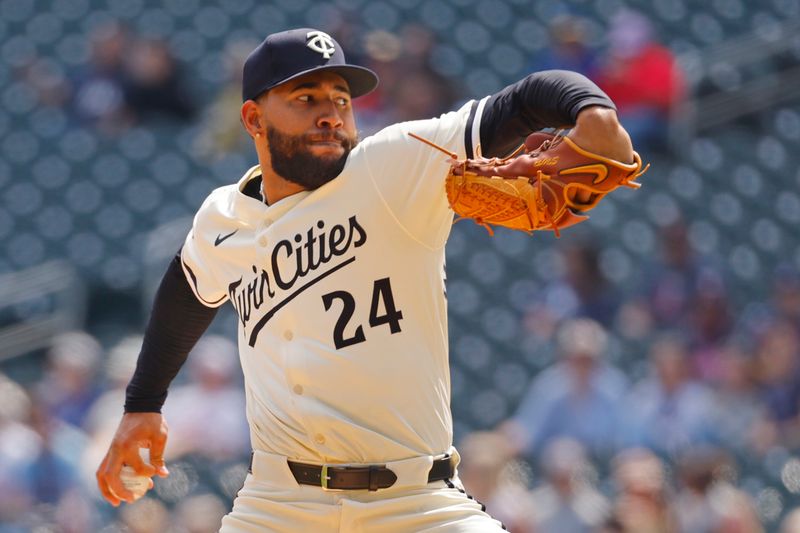 Apr 13, 2025; Minneapolis, Minnesota, USA; Minnesota Twins starting pitcher Simeon Woods Richardson (24) throws to the Detroit Tigers in the second inning at Target Field. Mandatory Credit: Bruce Kluckhohn-Imagn Images