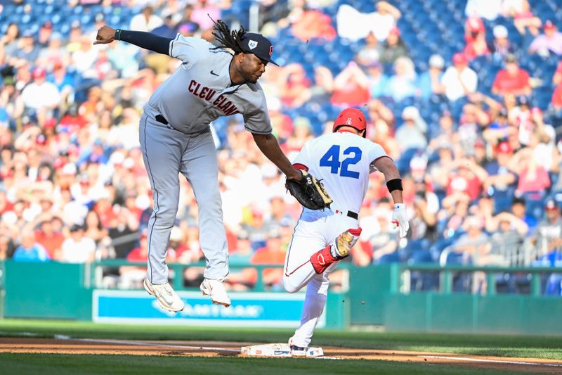 Apr 15, 2023; Washington, District of Columbia, USA; Washington Nationals left fielder Alex Call (17) beats the tag attempts of Cleveland Guardians first baseman Josh Bell (55) at first base during the first inning at Nationals Park. Mandatory Credit: Brad Mills-USA TODAY Sports