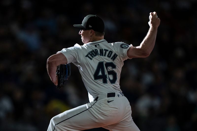 Jun 15, 2024; Seattle, Washington, USA; Seattle Mariners reliever Trent Thornton (46) delivers a pitch during the eighth inning against the Texas Rangers at T-Mobile Park. Mandatory Credit: Stephen Brashear-USA TODAY Sports