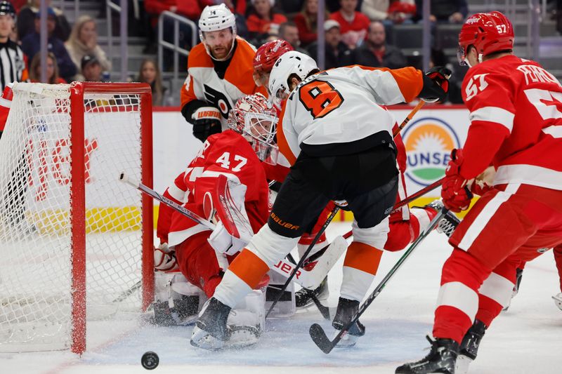 Dec 22, 2023; Detroit, Michigan, USA;  Detroit Red Wings goaltender James Reimer (47) makes a save on Philadelphia Flyers center Sean Couturier (14) in the third period at Little Caesars Arena. Mandatory Credit: Rick Osentoski-USA TODAY Sports