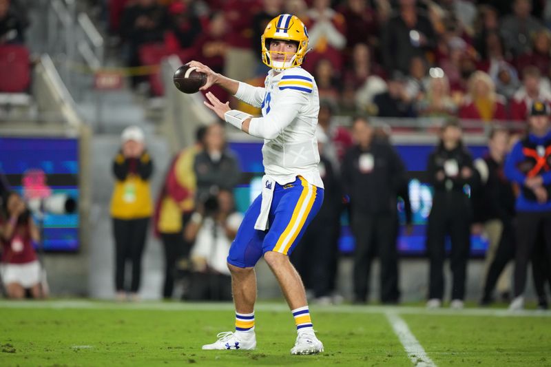 Nov 5, 2022; Los Angeles, California, USA; California Golden Bears quarterback Jack Plummer (13) throws the ball against the Southern California Trojans in the first half at United Airlines Field at Los Angeles Memorial Coliseum. Mandatory Credit: Kirby Lee-USA TODAY Sports