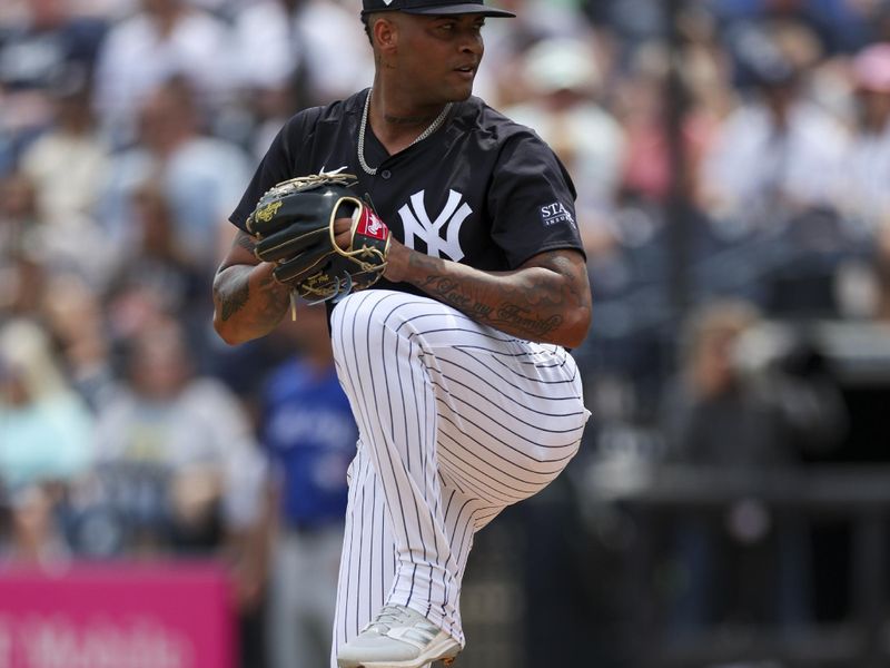 Mar 16, 2024; Tampa, Florida, USA;  New York Yankees pitcher Luis Gil (81) throws a pitch against the Toronto Blue Jays in the first inning at George M. Steinbrenner Field. Mandatory Credit: Nathan Ray Seebeck-USA TODAY Sports