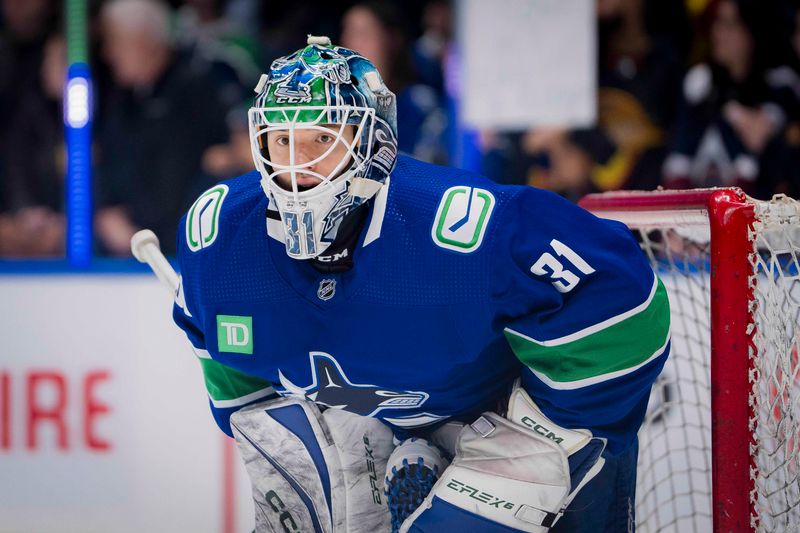 Mar 13, 2024; Vancouver, British Columbia, CAN; Vancouver Canucks goalie Arturs Silvos (31) waits for a shot during warm up prior to a game against the Colorado Avalanche at Rogers Arena. Mandatory Credit: Bob Frid-USA TODAY Sports