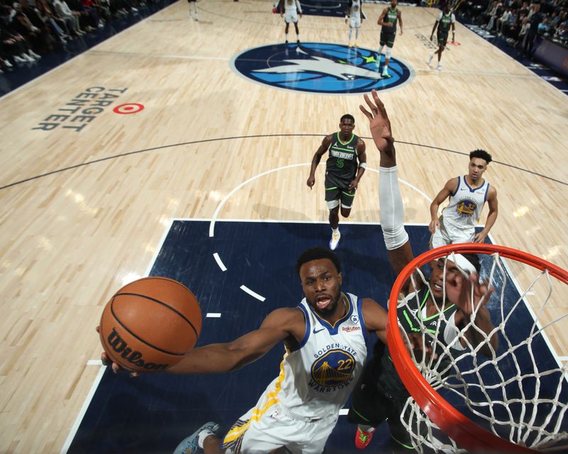 MINNEAPOLIS, MN -  MARCH 24: Andrew Wiggins #22 of the Golden State Warriors drives to the basket during the game against the Minnesota Timberwolves on March 24, 2024 at Target Center in Minneapolis, Minnesota. NOTE TO USER: User expressly acknowledges and agrees that, by downloading and or using this Photograph, user is consenting to the terms and conditions of the Getty Images License Agreement. Mandatory Copyright Notice: Copyright 2024 NBAE (Photo by Jordan Johnson/NBAE via Getty Images)