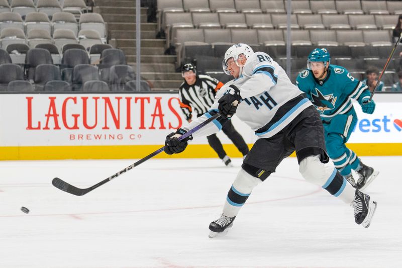 Oct 1, 2024; San Jose, California, USA;  Utah Hockey Club forward Aku Raty (85) shoots the puck during the first period against the San Jose Sharks at SAP Center at San Jose. Mandatory Credit: Stan Szeto-Imagn Images
