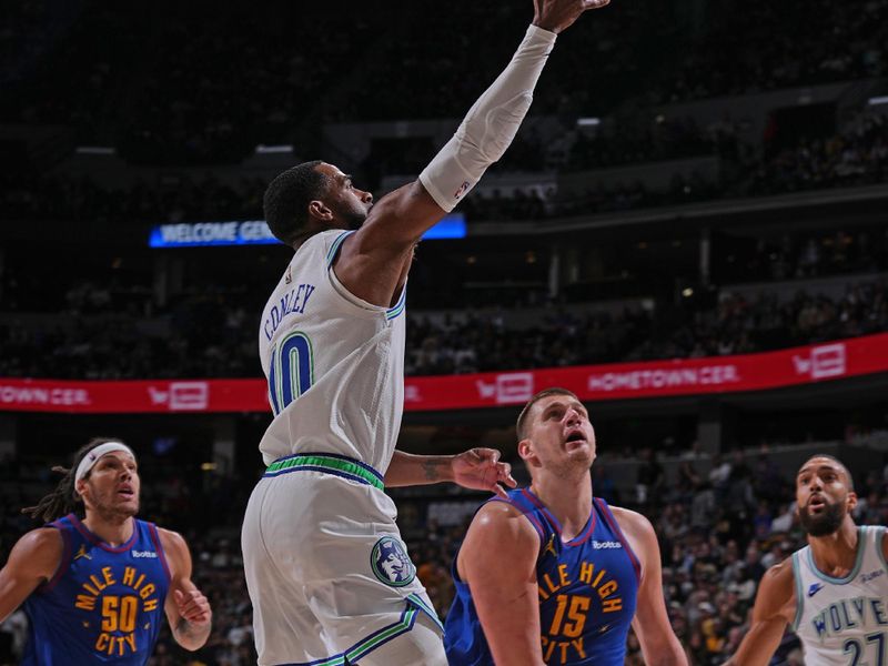 DENVER, CO - MARCH 29: Mike Conley #10 of the Minnesota Timberwolves drives to the basket during the game against the Denver Nuggets on March 29, 2024 at the Ball Arena in Denver, Colorado. NOTE TO USER: User expressly acknowledges and agrees that, by downloading and/or using this Photograph, user is consenting to the terms and conditions of the Getty Images License Agreement. Mandatory Copyright Notice: Copyright 2024 NBAE (Photo by Bart Young/NBAE via Getty Images)