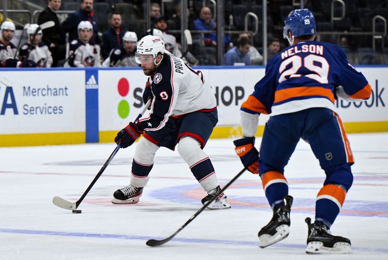 Dec 7, 2023; Elmont, New York, USA; Columbus Blue Jackets defenseman Ivan Provorov (9) skates with the puck against New York Islanders center Brock Nelson (29) during the third period at UBS Arena. Mandatory Credit: John Jones-USA TODAY Sports