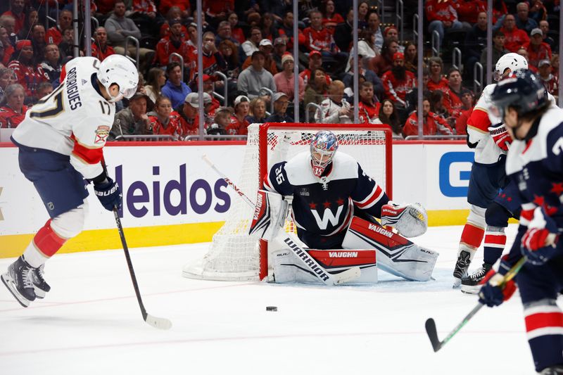 Nov 8, 2023; Washington, District of Columbia, USA; Washington Capitals goaltender Darcy Kuemper (35) makes a save on Florida Panthers center Evan Rodrigues (17) in the second period at Capital One Arena. Mandatory Credit: Geoff Burke-USA TODAY Sports