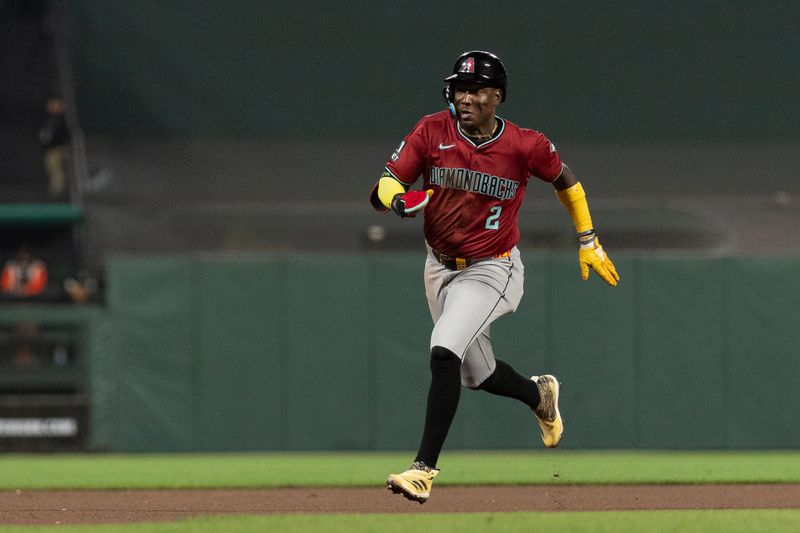 Sep 4, 2024; San Francisco, California, USA;  Arizona Diamondbacks shortstop Geraldo Perdomo (2) runs towards third base during the seventh inning against the San Francisco Giants at Oracle Park. Mandatory Credit: Stan Szeto-Imagn Images