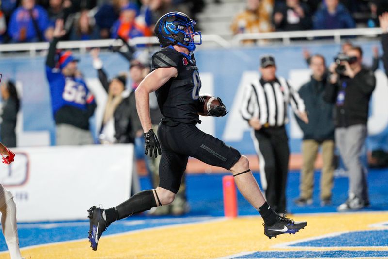 Nov 11, 2023; Boise, Idaho, USA;  Boise State Broncos wide receiver Austin Bolt (81) scores a touchdown during the first half against the New Mexico Lobos at Albertsons Stadium. Mandatory Credit: Brian Losness-USA TODAY Sports


