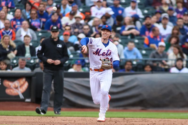 Jun 3, 2023; New York City, New York, USA;  New York Mets third baseman Brett Baty (22) throws a runner out at first in the fifth inning against the Toronto Blue Jays at Citi Field. Mandatory Credit: Wendell Cruz-USA TODAY Sports