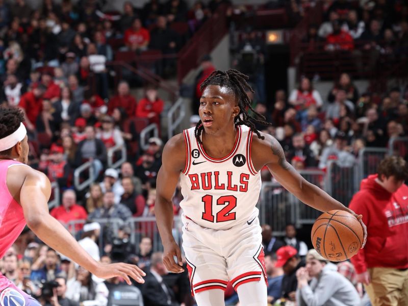 CHICAGO, IL - FEBRUARY 26: Ayo Dosunmu #12 of the Chicago Bulls dribbles the ball during the game against the Washington Wizards on February 26, 2023 at United Center in Chicago, Illinois. NOTE TO USER: User expressly acknowledges and agrees that, by downloading and or using this photograph, User is consenting to the terms and conditions of the Getty Images License Agreement. Mandatory Copyright Notice: Copyright 2023 NBAE (Photo by Jeff Haynes/NBAE via Getty Images)