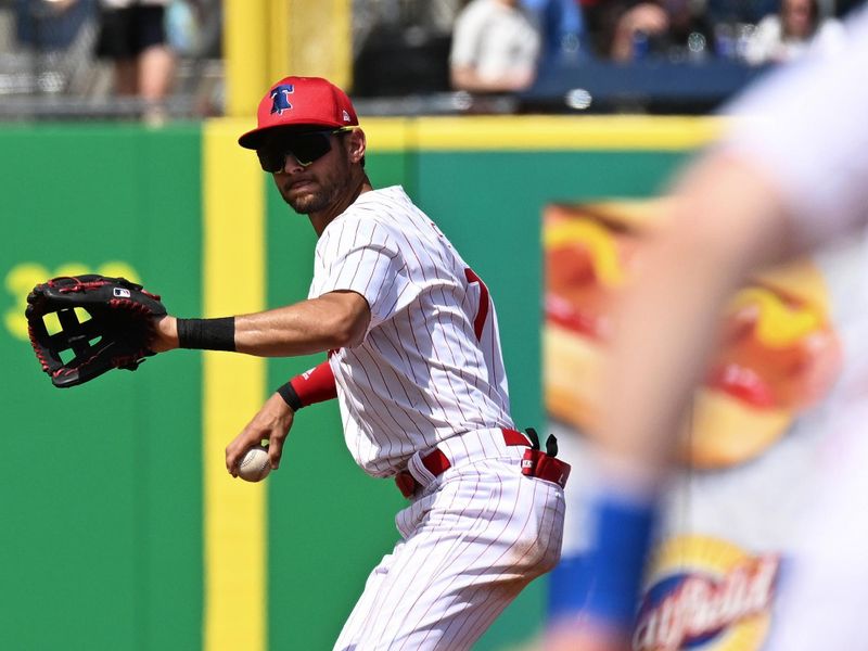 Mar 8, 2024; Clearwater, Florida, USAiPhiladelphia Phillies shortstop Trea Turner (7) prepares to throw to first base in the second inning of the spring training game against the Houston Astros at BayCare Ballpark. Mandatory Credit: Jonathan Dyer-USA TODAY Sports