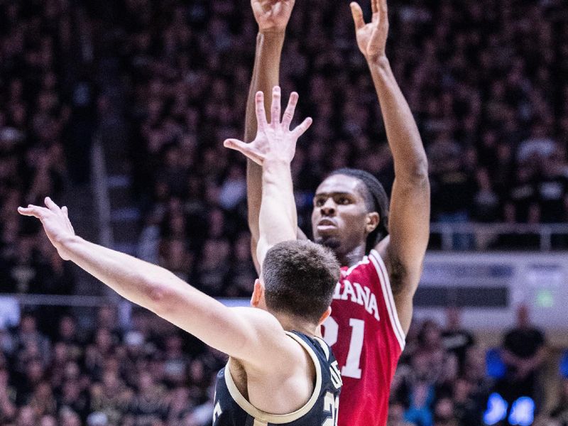 Feb 10, 2024; West Lafayette, Indiana, USA; Indiana Hoosiers forward Mackenzie Mgbako (21) shoots the ball while Purdue Boilermakers guard Ethan Morton (25) defends in the first half at Mackey Arena. Mandatory Credit: Trevor Ruszkowski-USA TODAY Sports