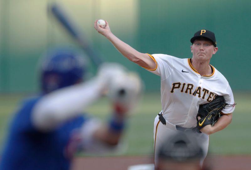 Aug 26, 2024; Pittsburgh, Pennsylvania, USA;  Pittsburgh Pirates starting pitcher Mitch Keller (23) delivers a pitch to Chicago Cubs designated hitter Seiya Suzuki (27) during the first inning at PNC Park. Mandatory Credit: Charles LeClaire-USA TODAY Sports