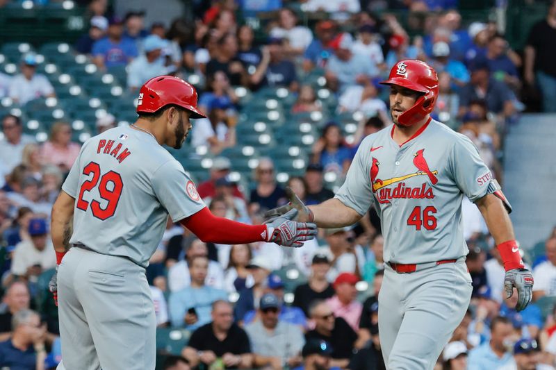 Aug 1, 2024; Chicago, Illinois, USA; St. Louis Cardinals first baseman Paul Goldschmidt (46) celebrates with outfielder Tommy Pham (29) after hitting a solo home run against the Chicago Cubs during the first inning at Wrigley Field. Mandatory Credit: Kamil Krzaczynski-USA TODAY Sports