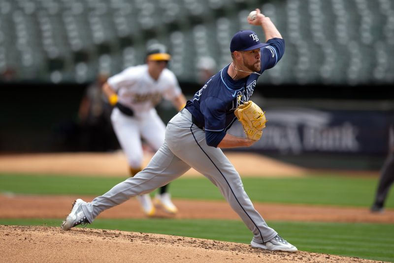 Aug 22, 2024; Oakland, California, USA; Tampa Bay Rays starting pitcher Jeffrey Springs (59) delivers a pitch against the Oakland Athletics during the second inning at Oakland-Alameda County Coliseum. Mandatory Credit: D. Ross Cameron-USA TODAY Sports