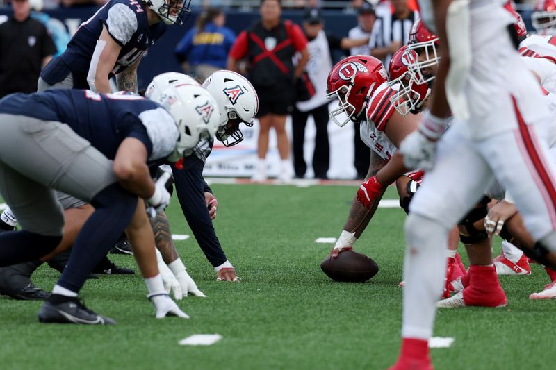 Nov 18, 2023; Tucson, Arizona, USA; The Utah Utes and the Arizona Wildcats wait for the snap during the second half at Arizona Stadium. Mandatory Credit: Zachary BonDurant-USA TODAY Sports