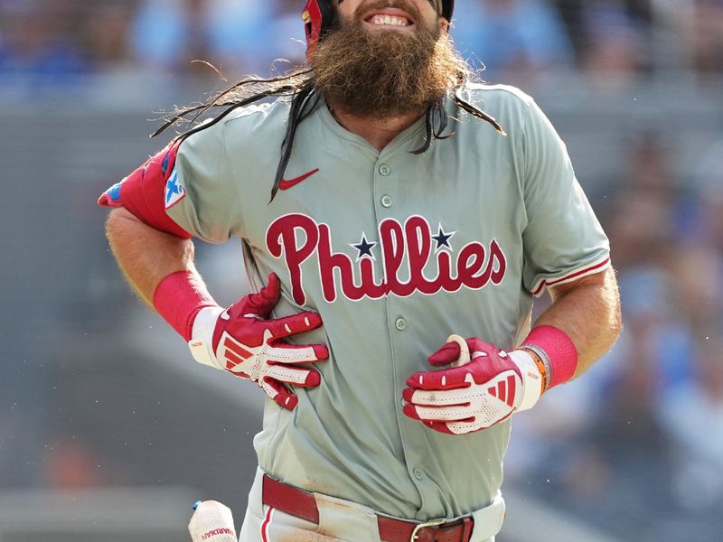 Sep 4, 2024; Toronto, Ontario, CAN; Philadelphia Phillies left fielder Brandon Marsh (16) reacts after getting hit with a pitch against the Philadelphia Phillies during the seventh inning at Rogers Centre. Mandatory Credit: Nick Turchiaro-Imagn Images